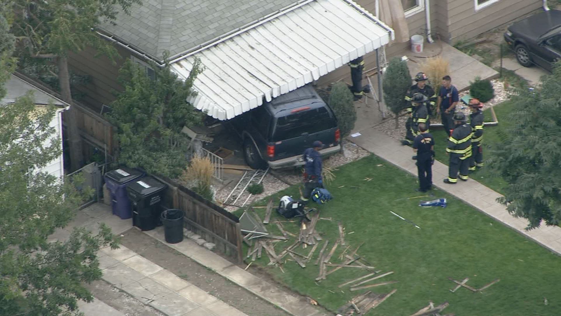 2 injured after SUV crashes into Denver home | 9news.com