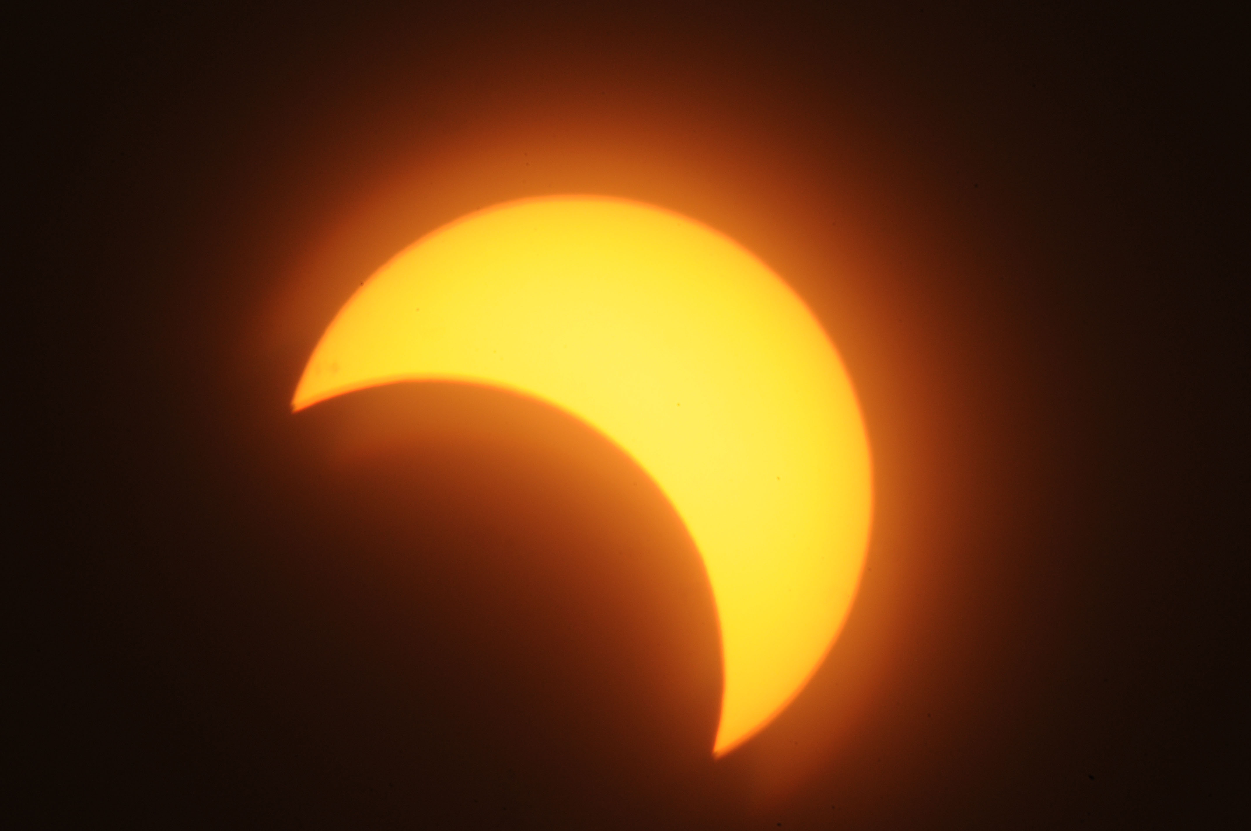 Partial solar eclipse darkens Colorado sky