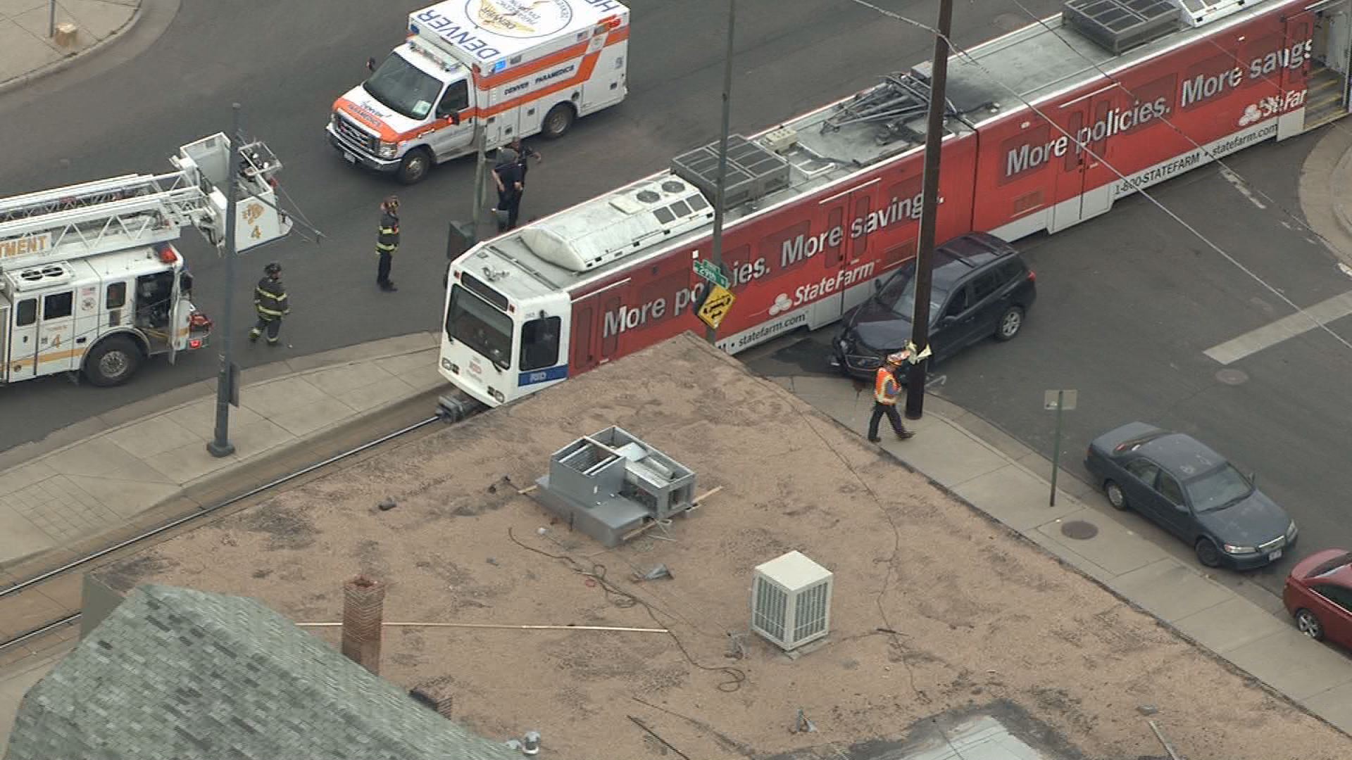SUV crashes into light rail train in Denver | 9news.com