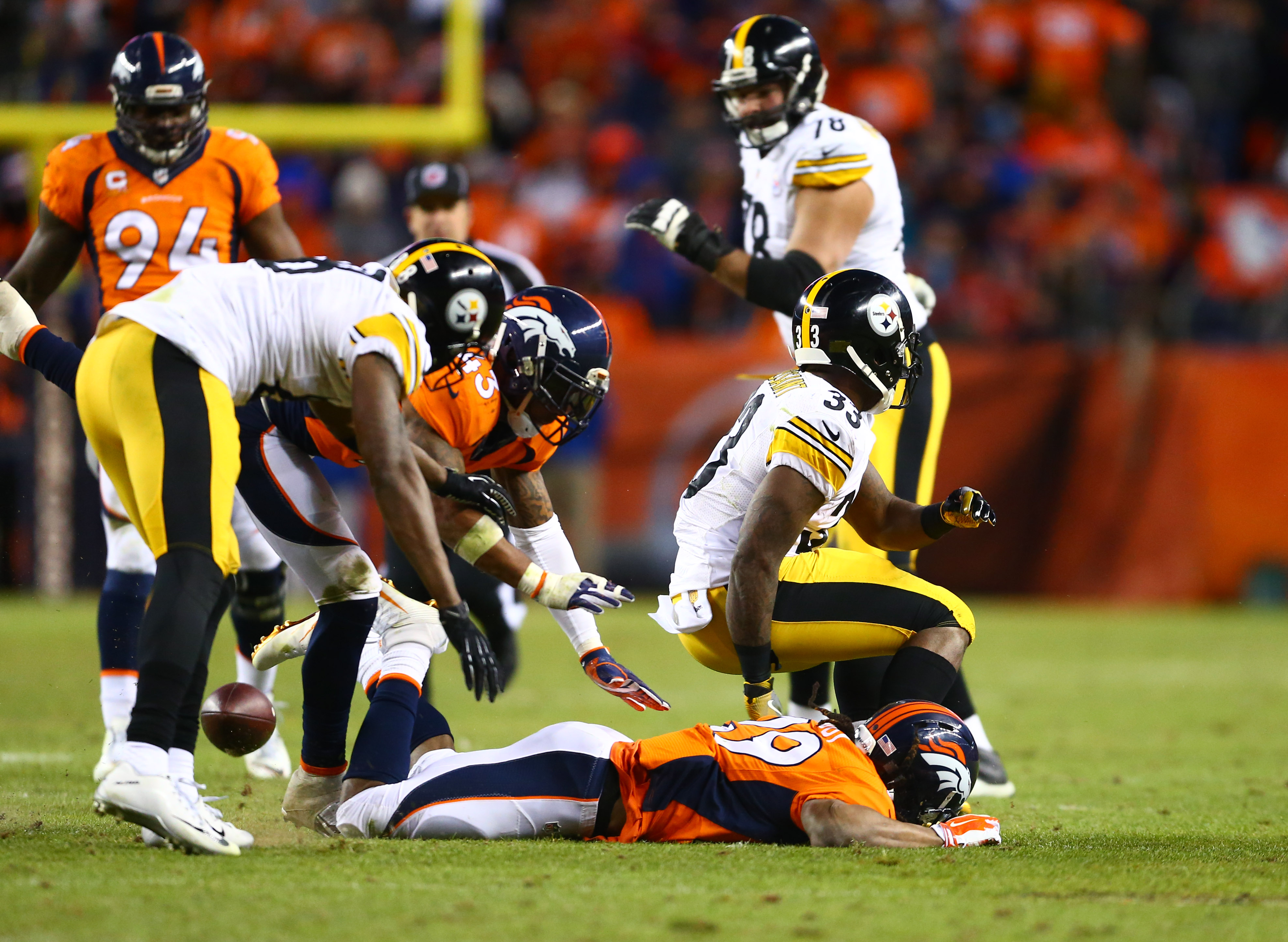 Denver Broncos wide receiver Demaryius Thomas (88) and running back C.J.  Anderson (22) celebrate after Thomas made a touchdown catch in the first  half of an NFL football game against the Pittsburgh