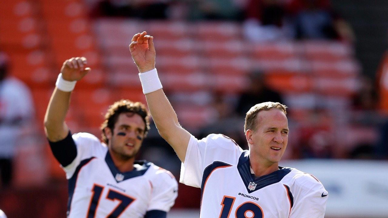 Peyton Manning of the Denver Broncos warms up prior to playing in