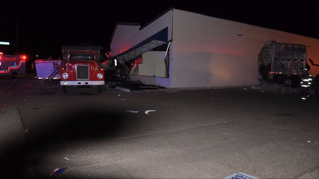 Speeding semi plows into building