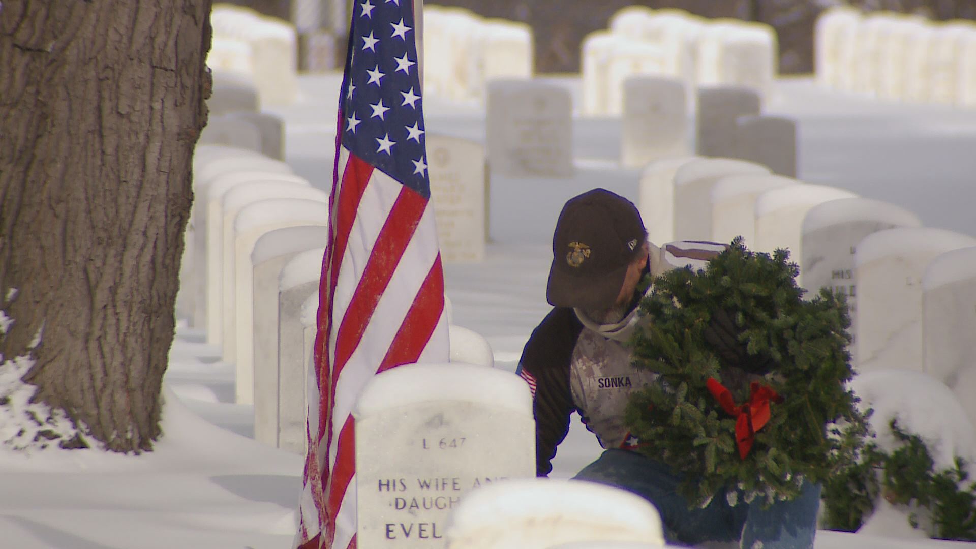Hundreds lay wreaths at Fort Logan Cemetery
