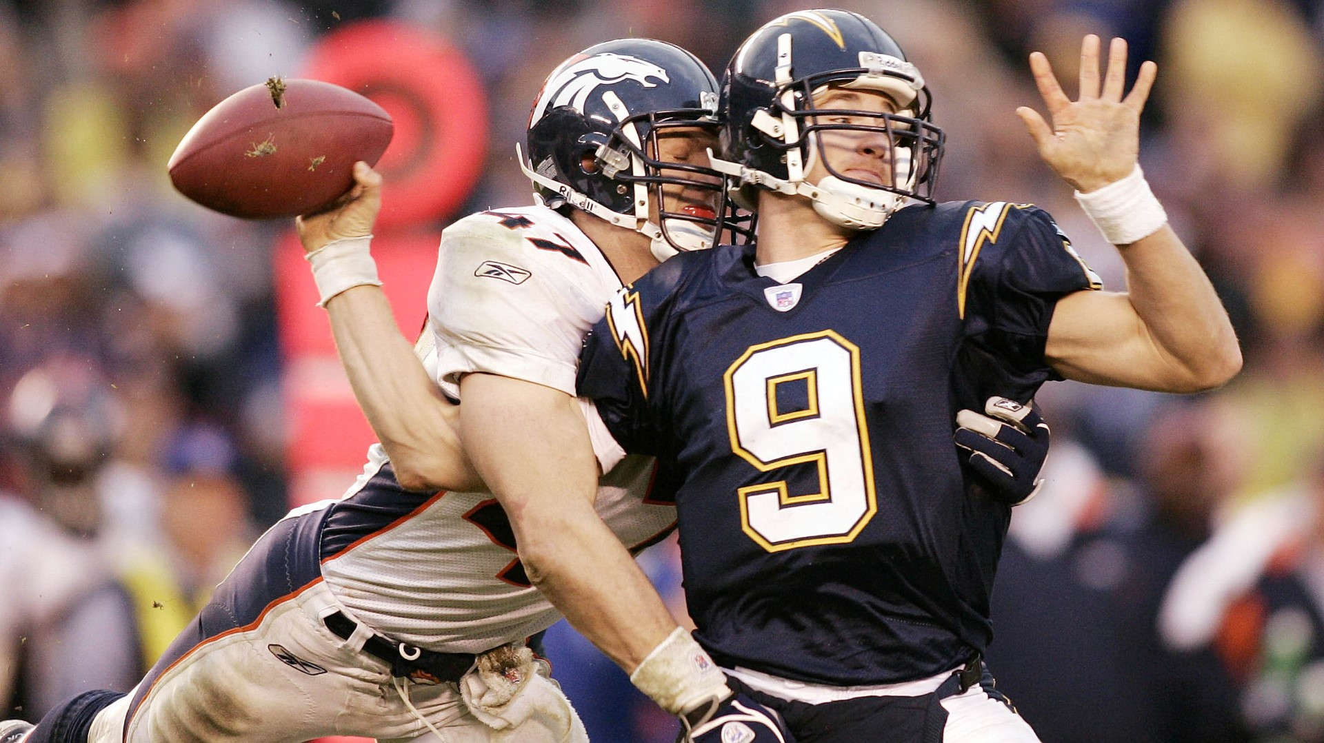 Jan 26, 2003 - San Diego, California, USA - WARREN SAPP of the Tampa Bay  Buccaneers gets up close and personal with teammate JOHN LYNCH prior to  Super Bowl XXXVII between the