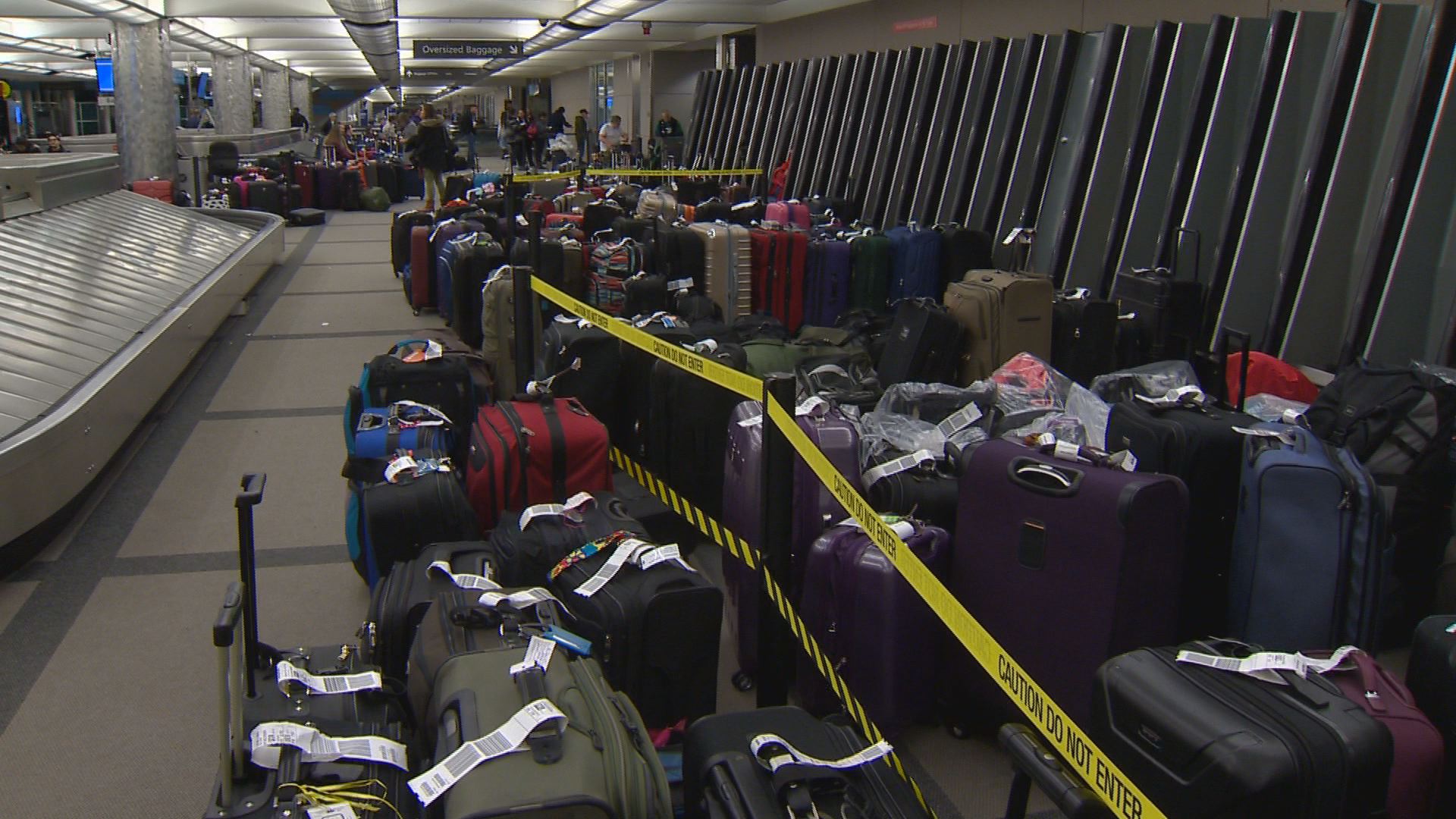 Bags still piled up after Frontier mess at DIA | 9news.com